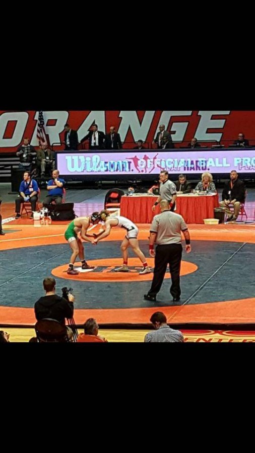 Berta tangles up with his opponent at the IHSA State finals at the University of Illinois