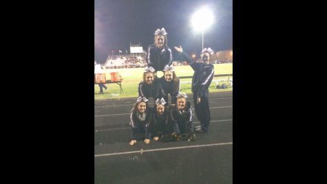 Senior cheerleaders at Tinely Park football game to show their spirit through the ‘traditional’ way of doing a pyramid.