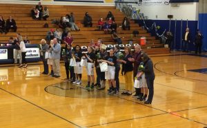 Senior players and their parents get honored before the game.