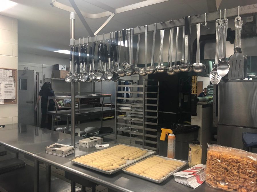 Behind the scenes in the kitchen, where french fries and bosco sticks are being prepared by the staff in the cafeteria. The average shift starts at 6:30 a.m. and ends at 1:00 p.m. This goes to show how hard the lunch ladies work to provide meals for students. 