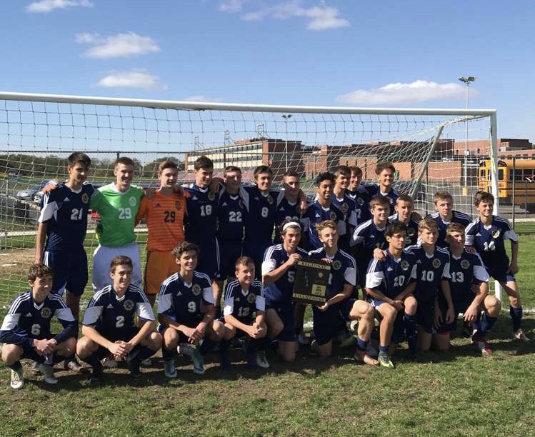 Boys’ team celebrates their 2-1 regional victory over the Illinois Math Science Academy Titans on Oct. 20. They are upper row left to right: David Zalinski, Matthew Morley, Kenny Benoit, Tobias Hagen,William Harris, Mateusz Otreba, John Chraca, Daniel Zuniga, Adam Hornik, Jake Duchon, Matthew Gasienica. Middle row left to right: Peter Borzecki, Sebastian Milkos, Andrew Leja, Erik Brztowski. Bottom row left to right: Connor Kirk, James LoCascio, Andrew Juarez, Lucas Otreba, William Bozue, Andrius Alinkevicius, Leonardo Nunez, Sebastian Kozieja, Enis Ugljanin.
