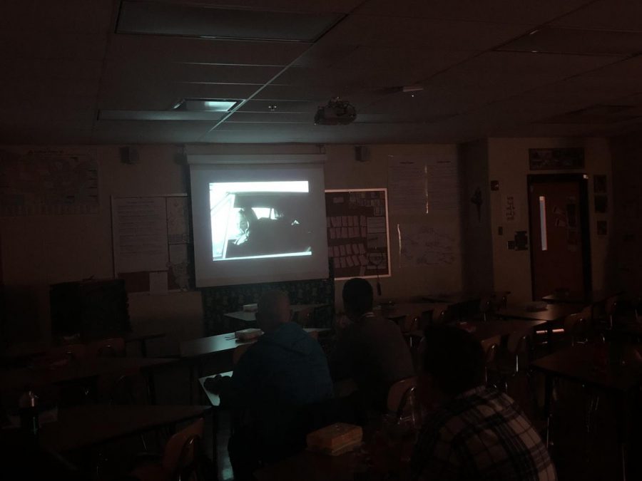 The Film Club meets in their personal theater in room 115, watching Night of the Living Dead.
