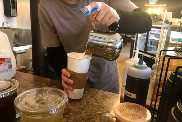 Higher Grounds Coffee Co. owner, Deanna Lileikis, prepares one of their famous Chunky Monkey Lattes for one of their regular customers. Higher Grounds is located at 223 Main St. in downtown Lemont.