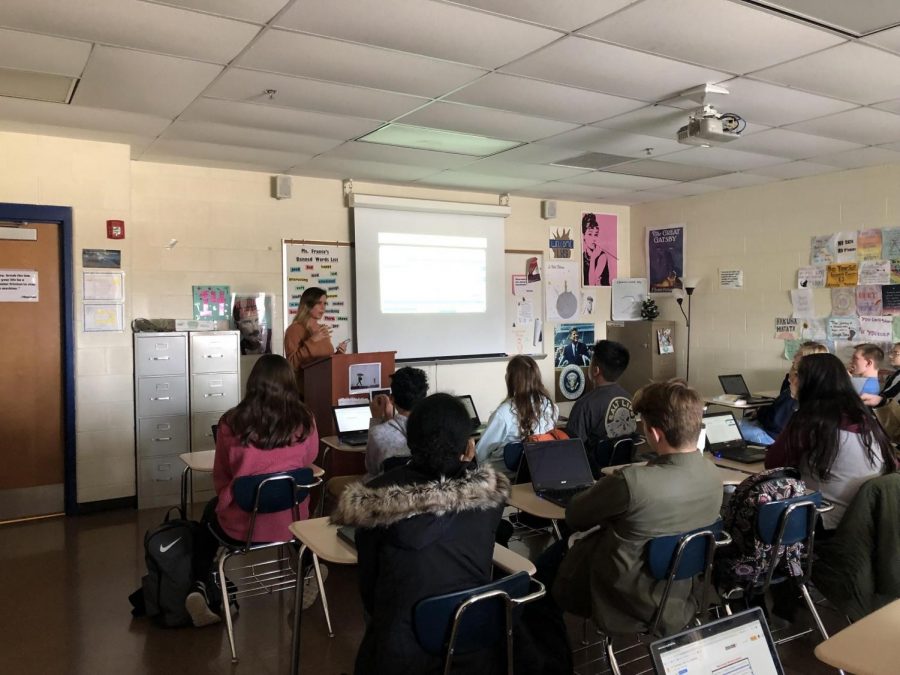 Mrs. Forde explaining how to write a rhetorical analysis to her B3 English II Honors class. Mrs. Forde said, “I enjoy being outside in my freetime, running clears my mind.”
