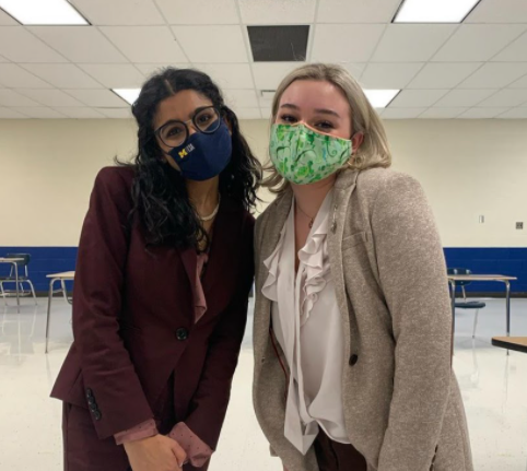 Senior Nour Longi and Sophomore Elle Jeffress posing after the Sectional, ready to compete this upcoming weekend. Photo taken by Philip Lazzari. 