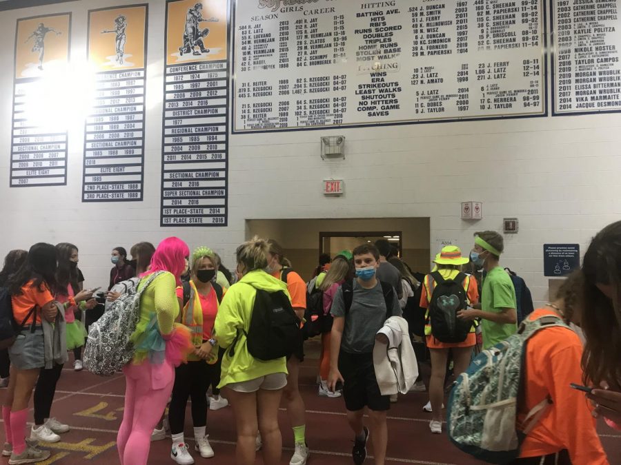 Students congregate after gym ends and show off their neon clothing.
