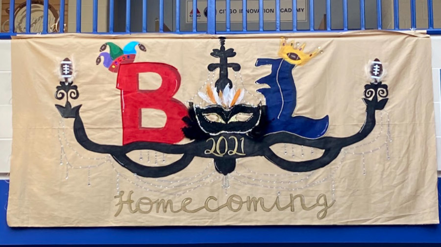 The senior banner paints a chandelier, with the Lemont and Bremen logos on each side. Bremen wears a jester hat, while Lemont wears a crown. Many jewels and gems dangle from the banner. 