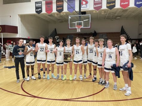 Lemont posing with their first Regional plaque since 1993 at Morris Community high school. Lemont ended the regular season with a record of 23-7 and a Deerfield MLK tournament Championship.