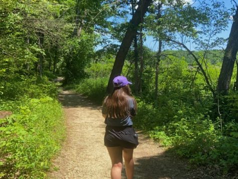 Anna Swenson hiking the Black Oak trail in Little Red Schoolhouse nature center.

