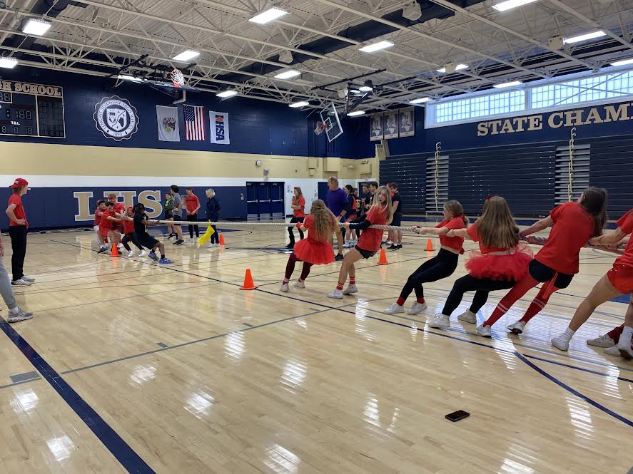 Two teams go head-to-head in an intense game of tug of war. “I definitely like this better, regular gym just wouldn’t be fun this week,” said sophomore April Rice.