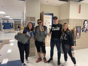 Many teachers love to participate in spirit week outfits with Jon Duguzmen typically standing out. With his iconic Dunkin iced coffee and capri leggings, he truly captured the essence of being a soccer mom. Pictured from left to right is Angela Duensing, Jon Deguzman, Brandon Hillary and Katheryn Kupchek.
