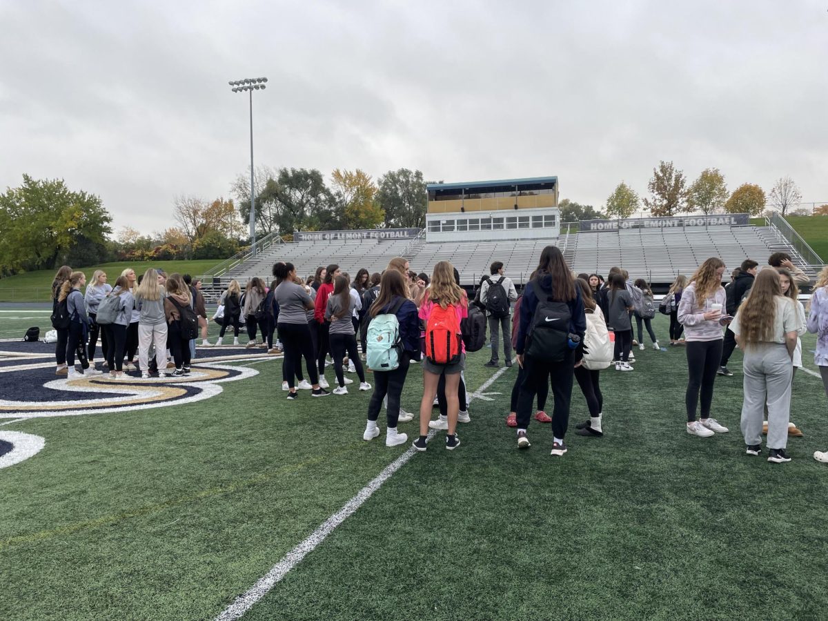 Students gather on the football field to “protest” for the Lemont girls volleyball team.
