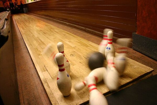 Rolling towards victory: bowling team faces defeat but hope lives on through individual success.