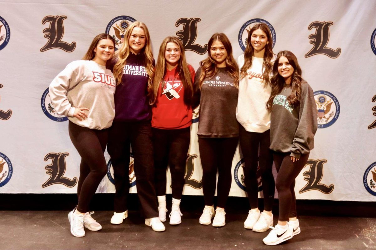 Athletes+are+allowed+to+sign+binding+contracts+with+their+committed+division+one+or+division+two+schools+starting+on+Nov.+8+which+is+National+Signing+Day.+LHS+had+a+variety+of+athletes+who+committed+but+softball+had+the+most+recruits+with+six+of+the+11+total+committed+athletes.+From+left%3A+Raegan+Duncan%2C+Avaree+Taylor%2C+Ava+Reed%2C+Rhea+Mardjetko%2C+Allison+Pawlowicz+and+Alyssa+Demaio.