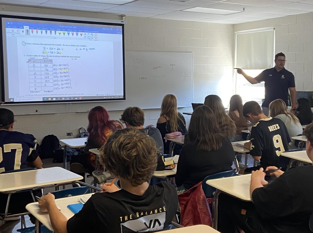 Mander teaches math lesson during co-taught G4 math 1 class.