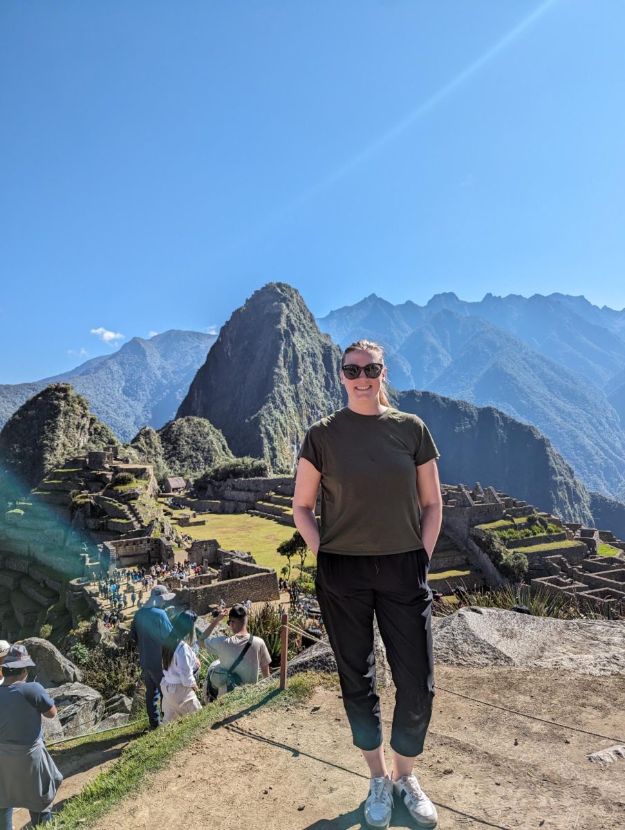 Lara Devries stands in front of Machu Picchu during a student trip.