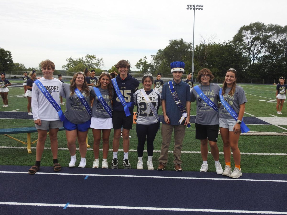 Homecoming Court princes, princesses, king and queen show-off their sashes and royal crowns. 