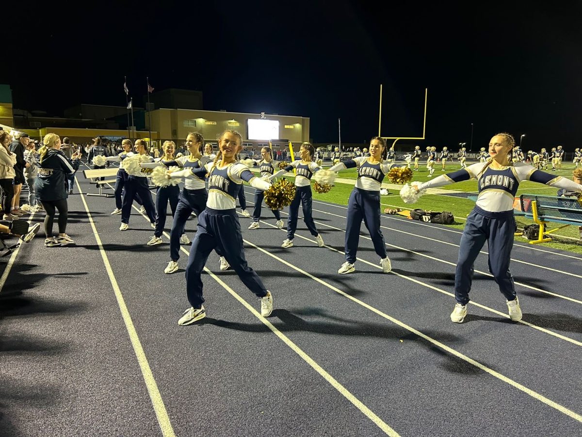 The varsity dance team cheers the team to victory as Lemont beats Thornton Fractional North 28–13. 