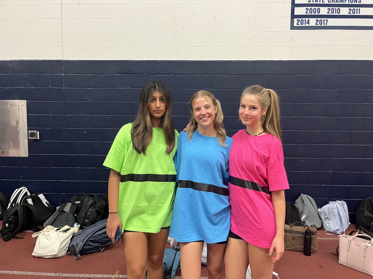 Senior students dress as the Powerpuff Girls for the second day of Homecoming spirit week. Left to right, Anika Reddy, Olivia Parent and Liepa Baranauskas.