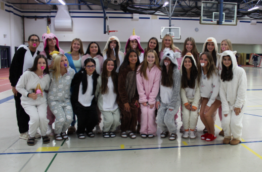 Freshman girls dressed in their baby attire pose for pictures during morning skits.

