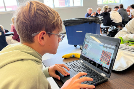 Freshman Alex Rychtarcyzk does AP Computer
Science Principles homework during lunch. 
